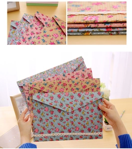 Detail of floral A4 document pouch with lace trim and metal snap button closure