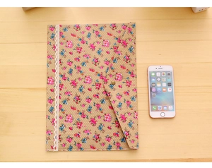 Close-up of khaki floral A4 document bag with pink flowers and white lace trim