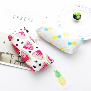 Detailed view of canvas pencil cases with watermelon and pineapple fruit patterns