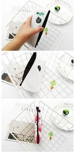 Detailed view of canvas pencil cases featuring cactus and watermelon prints with zippers