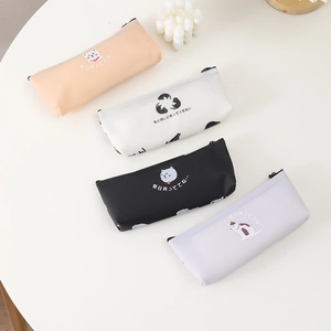 Cute 3D silicone cat pencil cases in four colors on a clean white round table
