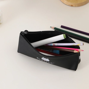 Detail of black cat pencil case with matte texture and Japanese character printing