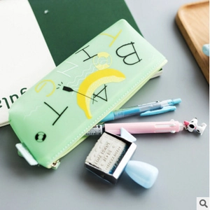 Mint green silicone triangle pencil case with yellow banana print and zipper closure