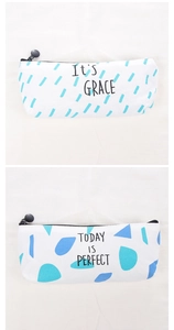 Detail view of canvas pencil cases with blue drop patterns and today is perfect text