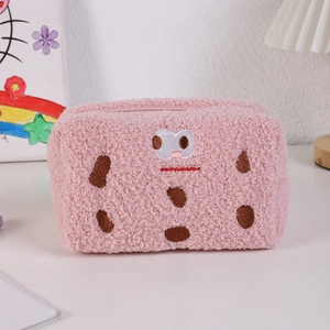Detail of plush pink biscuit pencil case with soft faux fur and cute embroidery