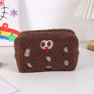 Close-up of soft plush sandwich biscuit pencil case with cute embroidered facial expression