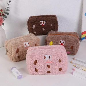 Cute biscuit-shaped plush pencil bags in four colors with soft fabric and embroidery