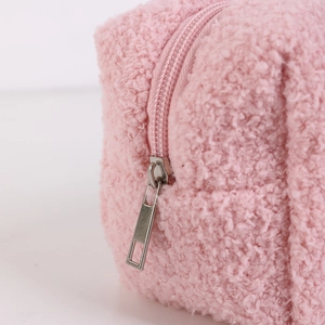 Close-up of pink plush sandwich pencil case with fluffy fleece texture and metal zipper