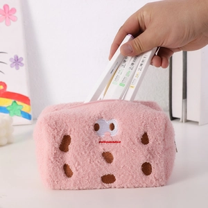 Detail showing the large capacity and soft plush texture of the pink pencil case