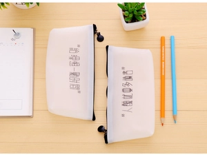 Macro detail of frosted translucent pencil bags with minimalist black Chinese characters