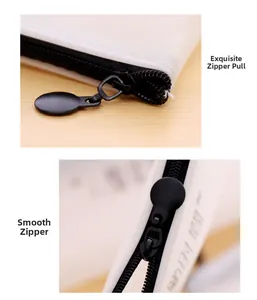 Close-up of smooth black metal zipper and large round puller on white pencil case