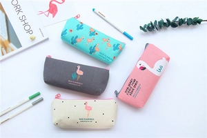 Detailed flat lay of four canvas flamingo pencil cases in mint, grey, beige, and pink colors