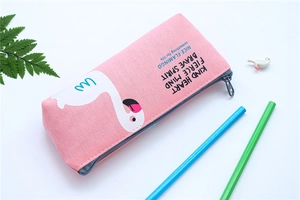 Pink canvas pencil case detail with white flamingo print and motivational English quotes