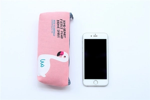 Pink flamingo canvas pencil case detail showing large capacity size relative to a phone