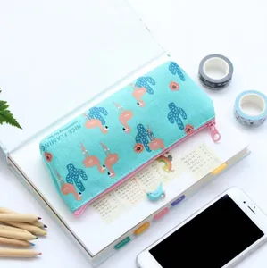 Large capacity canvas pencil case with flamingo and cactus patterns on a notebook