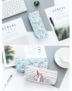 Detail of cute unicorn canvas pencil bags with blue prints and pink zipper pulls