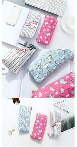 Detail of cute canvas unicorn pencil case with zipper and vibrant pastel graphic patterns