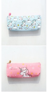 Detail of pink and blue unicorn canvas pencil cases with 'Dream like a unicorn' slogan
