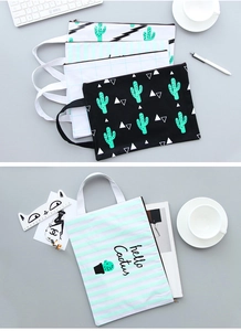 Detail of creative cactus canvas file bags with zipper closure and portable handles