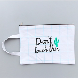 Detail of white mesh folder with blue grid, cactus print and Don't touch this text