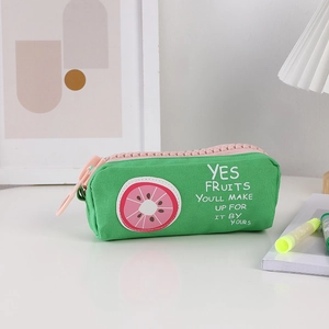 Detail of green canvas pencil case with large pink zipper and fruit print pattern