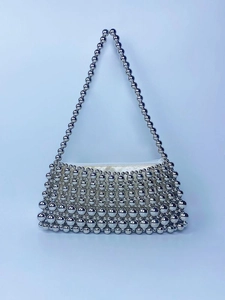 Handcrafted silver beaded baguette bag with pearl-style chain and woven texture