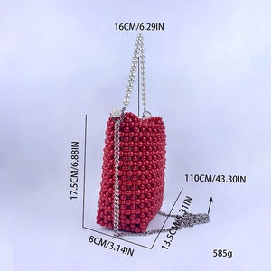 Detail view of red beaded bucket bag with pearl handle and silver chain strap dimensions