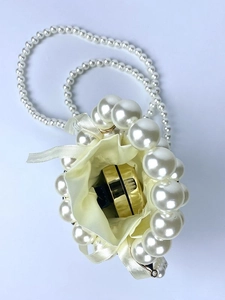 Handmade pearl mini bucket bag with drawstring satin lining and long pearl shoulder strap