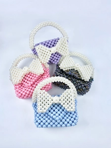 Mini borse di perle fatte a mano con grandi fiocchi in viola, rosa, nero e blu