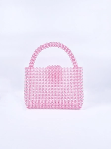 Detail of handmade pink acrylic beaded woven handbag with glossy translucent finish