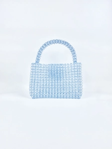 Detail of light blue handmade beaded handbag with transparent candy jelly texture and handle