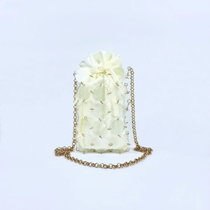 Detail of sequin mesh mini bag with satin drawstring pouch and gold chain strap
