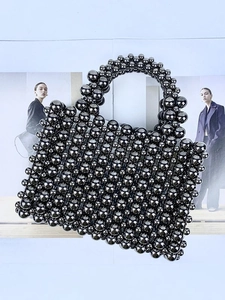 Handmade woven beaded handbag in metallic gunmetal grey with an elegant boxy shape