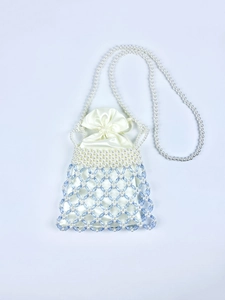 Detailed close-up of handmade pearl crossbody bag with blue crystal beads and satin lining