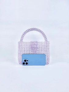 Detailed size comparison of a purple beaded tote bag next to a smartphone