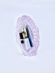 Top view of handmade purple beaded handbag showing interior storage for phone and makeup