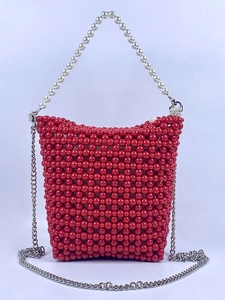 Handmade red beaded bucket bag with white pearl handle and silver crossbody chain strap