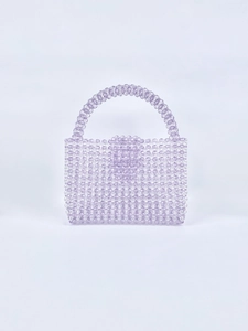 Detail of handmade lilac acrylic beaded handbag with high quality craftsmanship