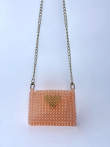 Handmade beaded mini crossbody bag with pink acrylic beads and golden heart detail