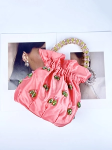 Pink satin drawstring handbag with beaded handle and colorful crystal insect embellishments