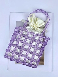 Handmade purple beaded handbag with cream silk drawstring liner and bow decoration