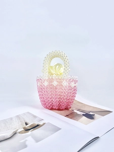 Handmade pink gradient beaded bucket bag with white pearl handle and satin drawstring lining