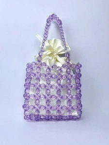 Handmade purple crystal beaded handbag featuring an elegant cream satin drawstring pouch inside
