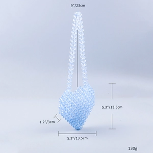 Detail view of mini light blue heart-shaped beaded acrylic crossbody bag with dimensions
