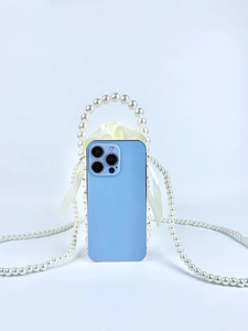 Elegant light blue iPhone case with pearl handle, crossbody chain and white silk bow tie