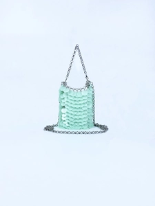 Detailed view of mint green sequin mini chain bag with fish scale paillettes decoration