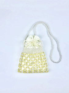 Detail of beaded drawstring bag with white pearls, yellow beads and satin inner pouch