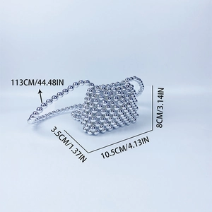 Detailed view of silver handmade beaded mini bag with 113cm shoulder strap and size markings