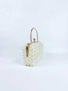 Detailed view of handmade pearl woven handbag with elegant gold metal top handle