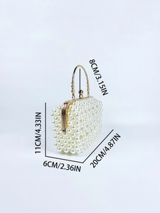 Detail showing dimensions of this white pearl clutch with gold handle for evening use